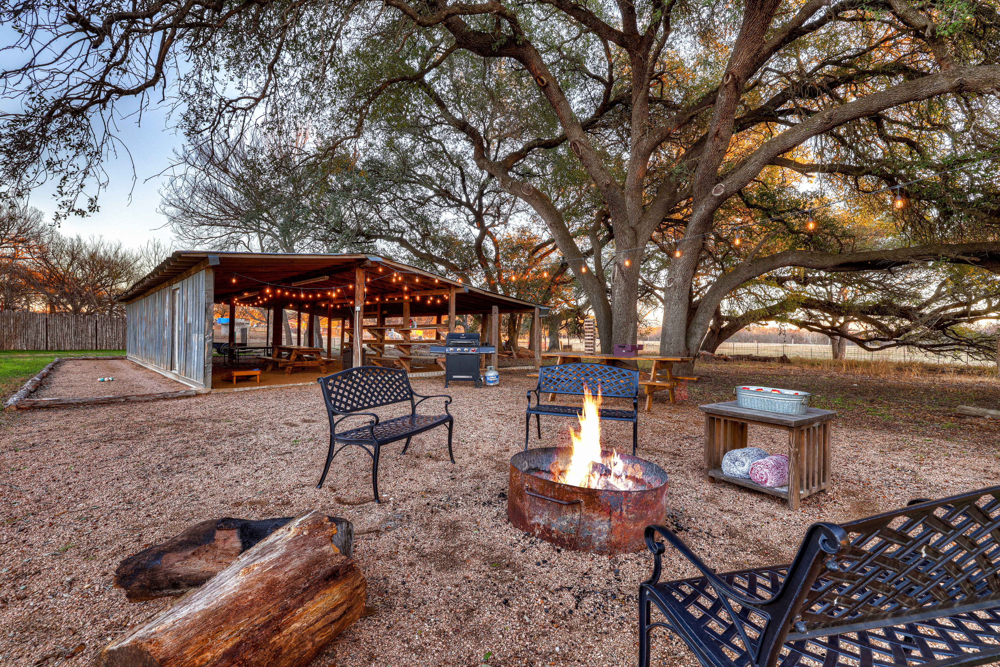 Gather around the firepit, play cornhole, and grill at the shared barn for endless outdoor fun.
