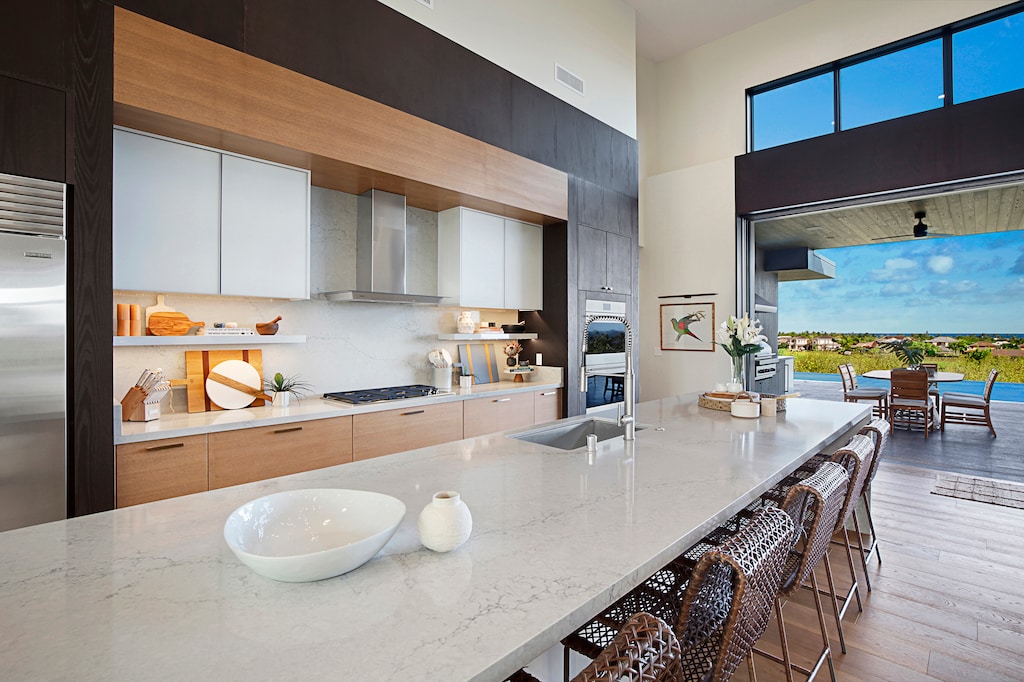 Entertaining and meal prepping made easy with this spacious kitchen and expansive bar countertop.