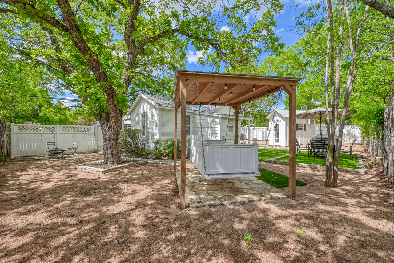 Inviting Backyard Area with Enchanting Swing