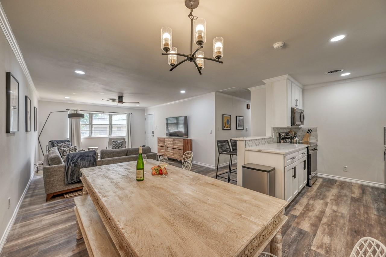 Gather around our charming farmhouse dining table! The long benches offer plenty of room for family and friends. The open concept design allows for easy conversation from the kitchen to the living room. Your ideal vacation begins here!