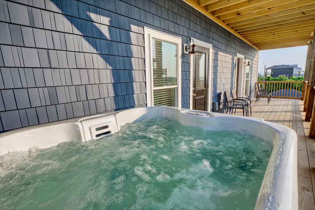 Private hot tub off of full bedroom with views of the sound