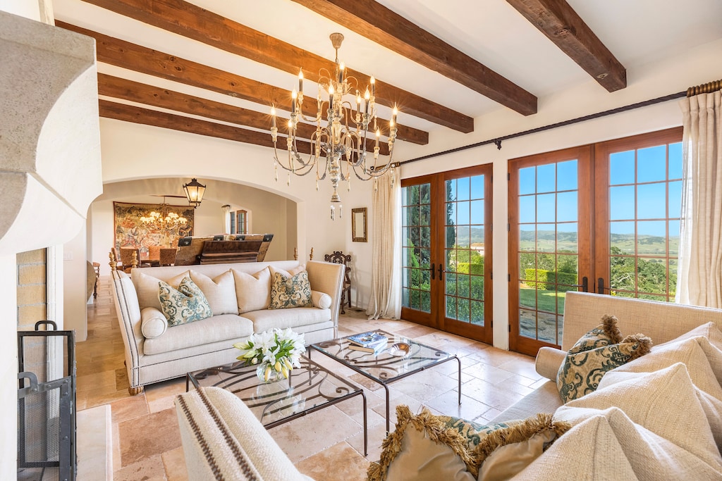 The formal living room offers comfortable seating and breathtaking views of the vineyards