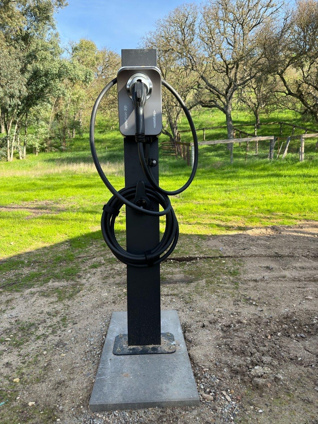 New EV charger recently installed, near the parking area