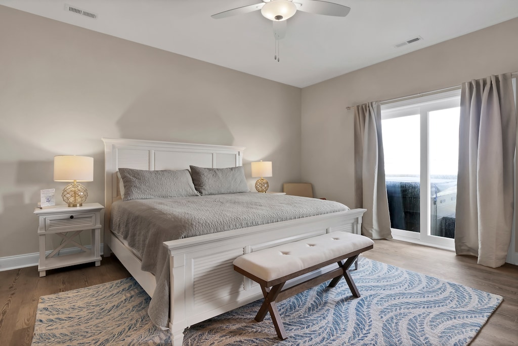 King master bedroom with attached full bath and deck access