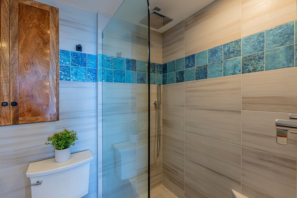 Walk in tiled shower in the primary bathroom.