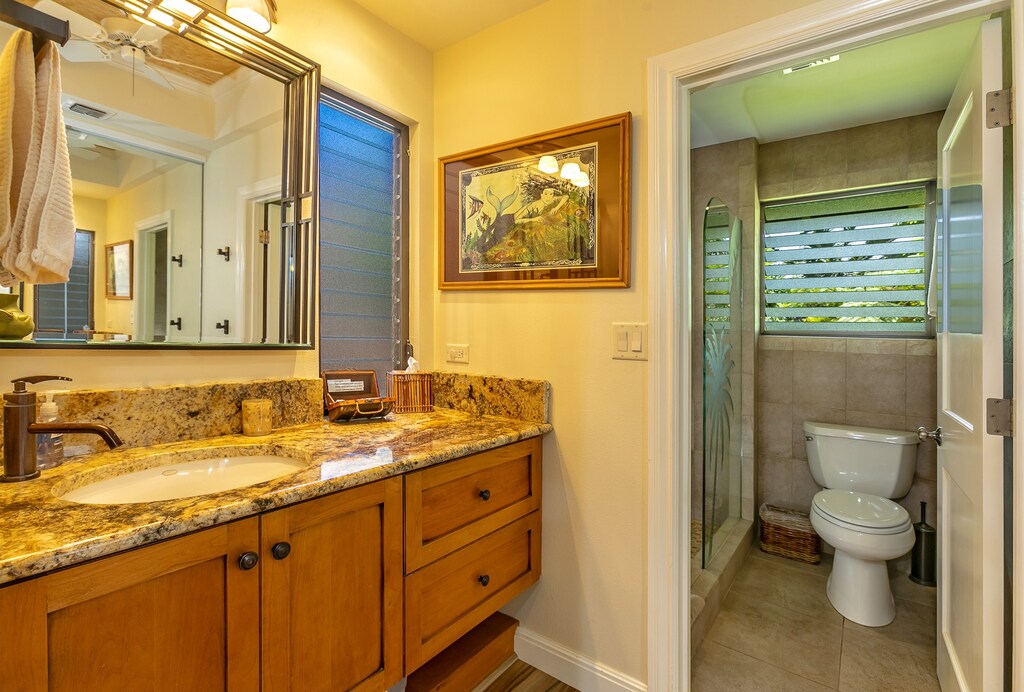 Vanity area with a private shower
