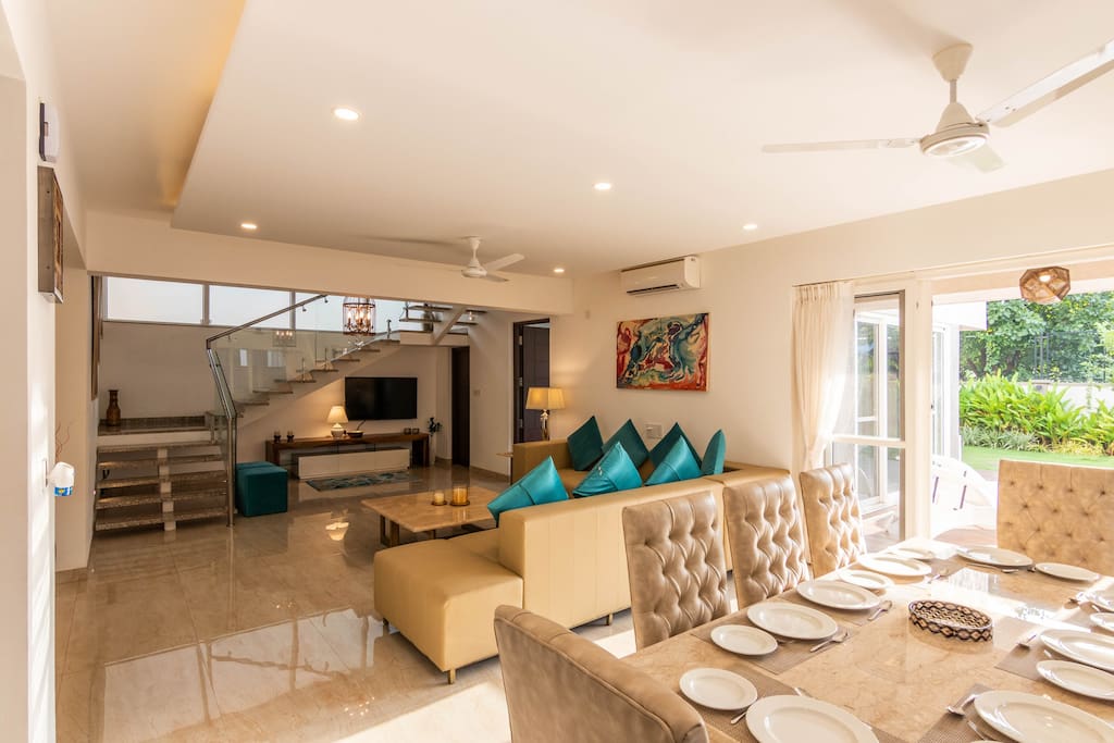 Our happy place - Spacious  air conditioned living room and dining area overlooking the pool