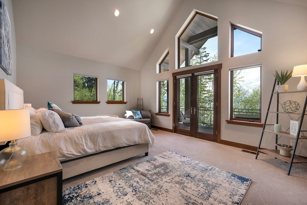 Master Bedroom 1 is located on the main level with access to the patio! The views are so dreamy! | King Bed