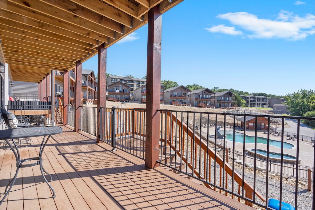 Lower Level Deck with a Direct Pool View and Stairs Directly Off the Deck for Easy Pool Access!