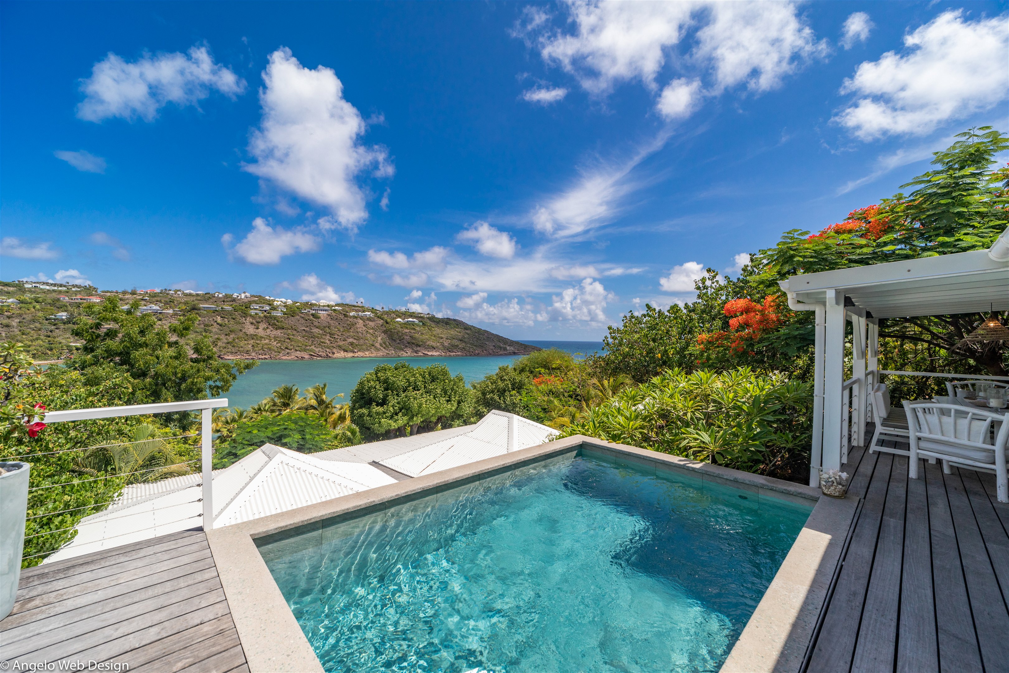 Nice pool facing the view, beautiful terrace with deck chairs and lounge area. 