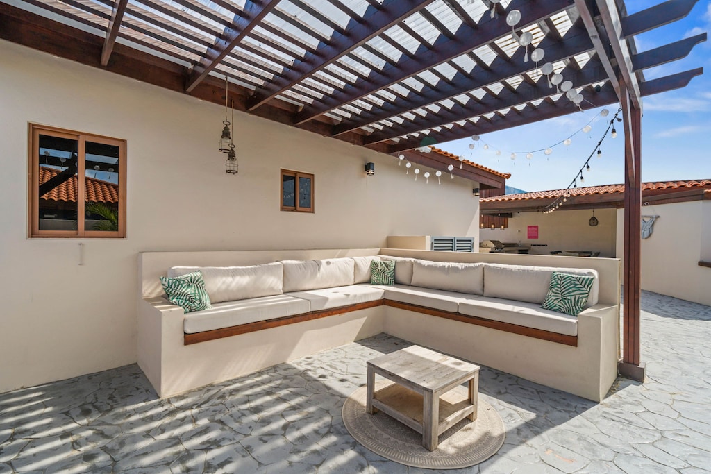 Enjoy the perfect blend of comfort and nature in our inviting outdoor lounge area.