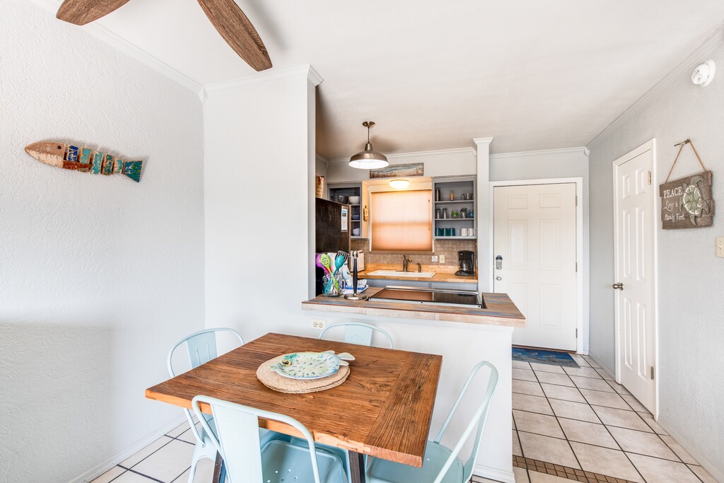 Dining and kitchen. Share meals and laughter in the stylish dining area, enhanced by the coastal ambiance.