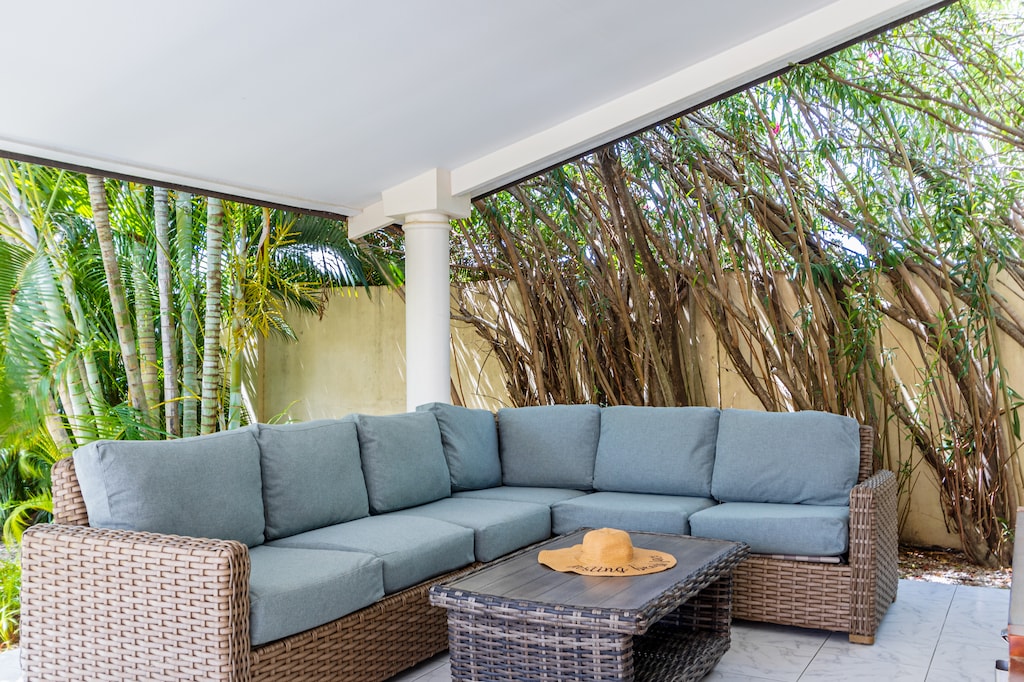 Plush Outdoor seating area of the Villa in Noord Aruba - Plush seating arrangements invite relaxation and stylish gatherings - Refreshing Atmosphere