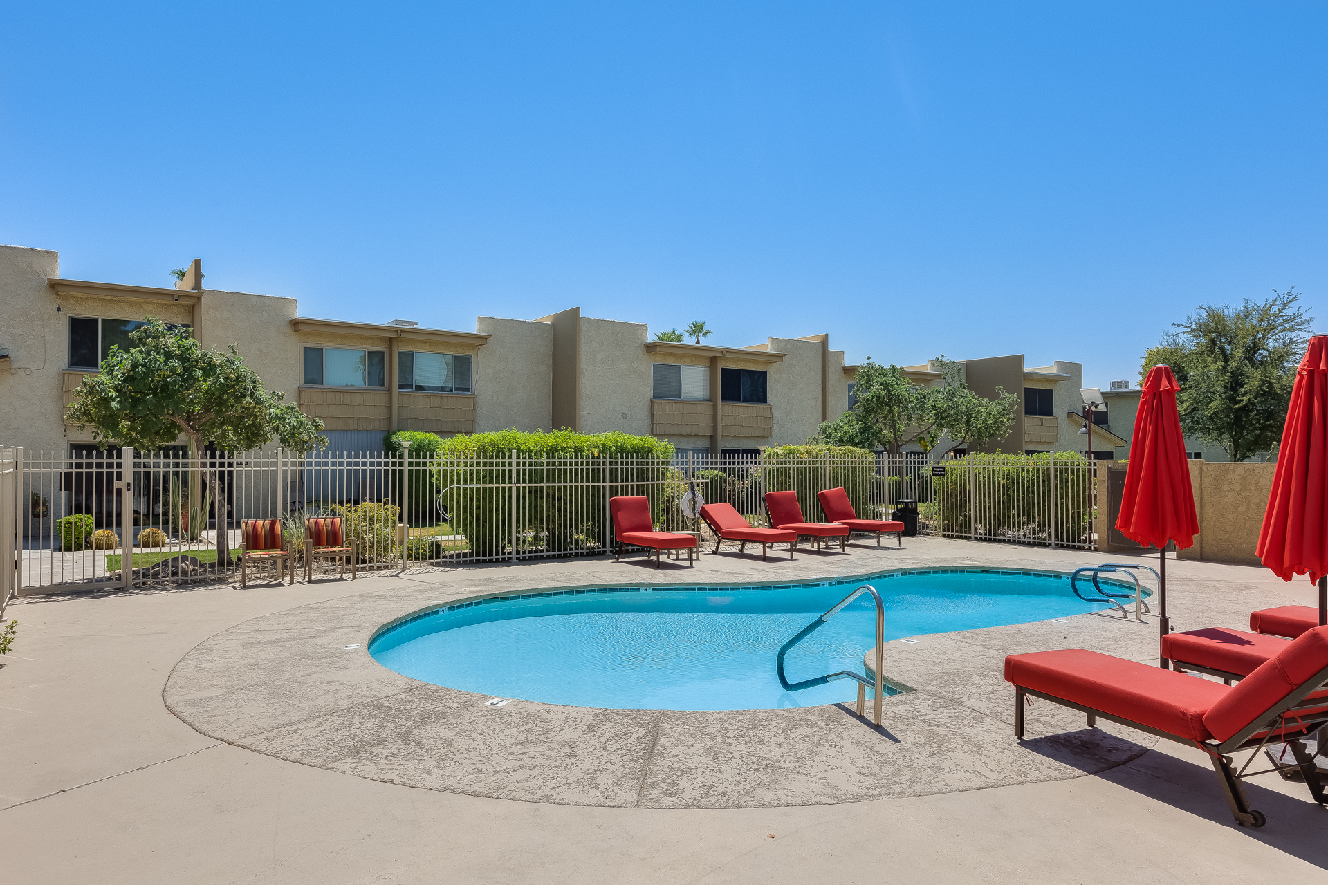 The condo's centerpiece is a stunning community pool, perfect for a refreshing dip or lounging under the Arizona sun.