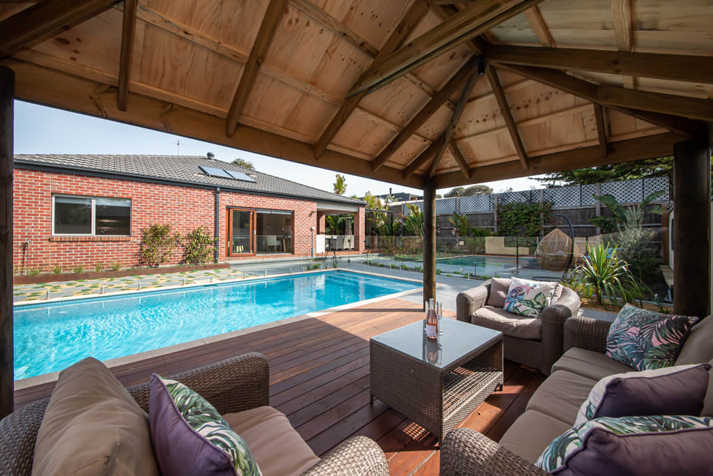 Pool Cabana with Lounge seating overlooking the pool and new landscaped gardens
