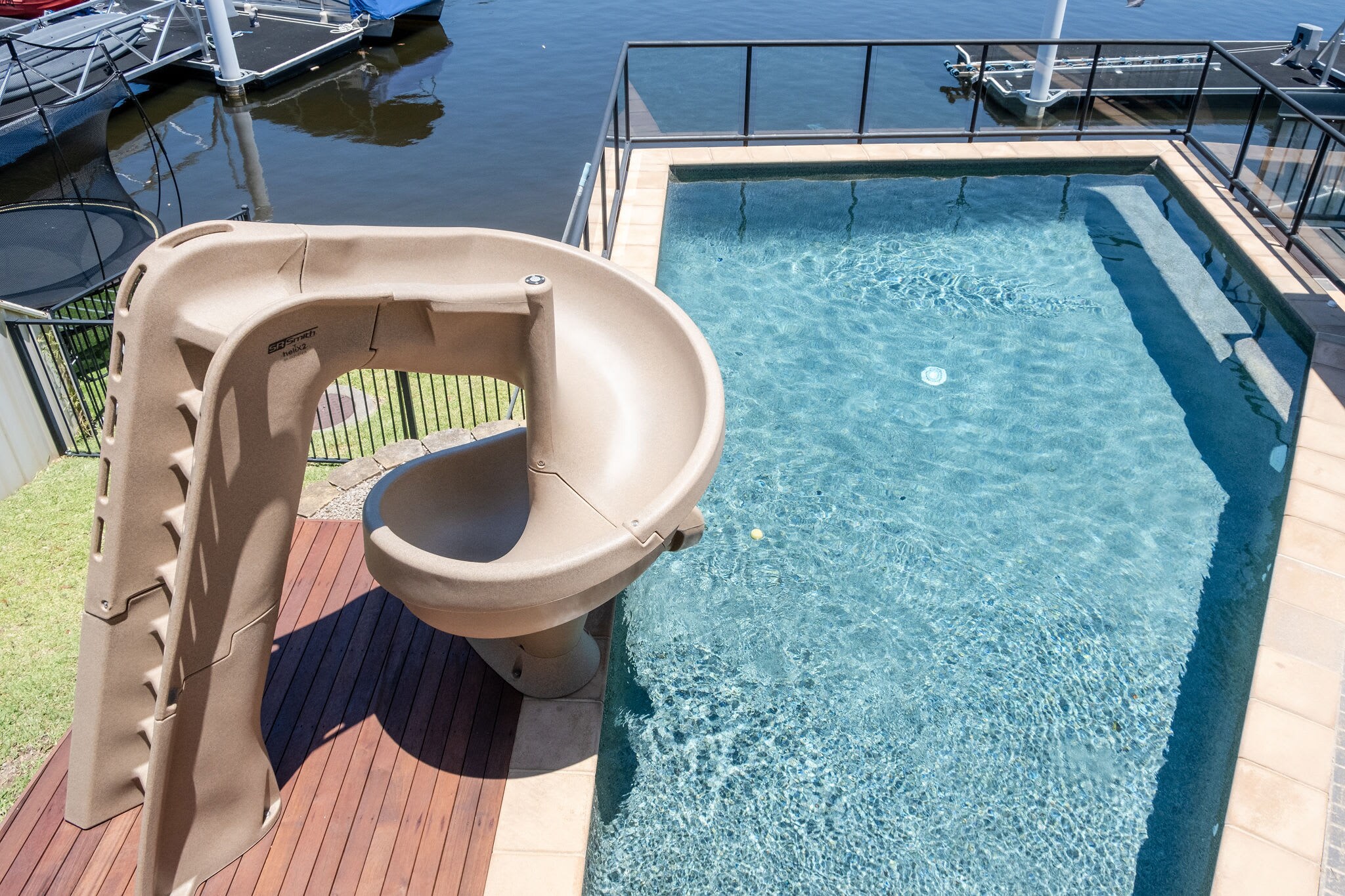 This incredible family home includes a pool and slide. This incredible family home includes a pool and slide.