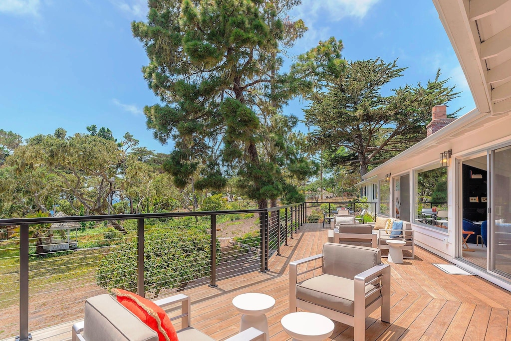 Outdoor Living and Dining Deck Overlooks the Backyard