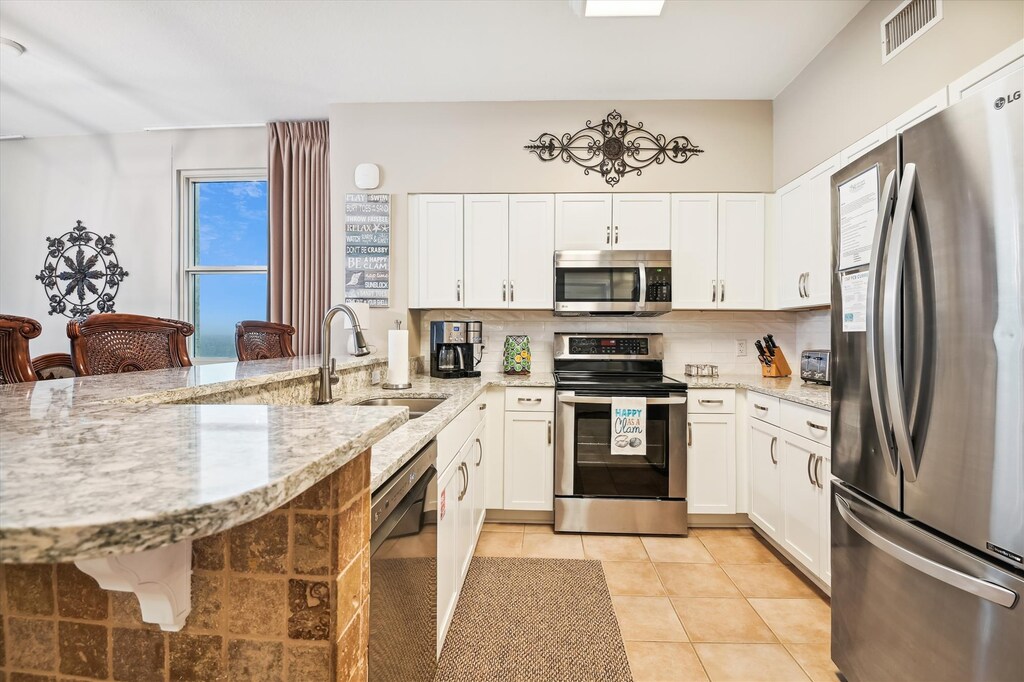 Fully furnished kitchen with custom granite countertops, stainless steel appliances, & Cuisinart dual serve coffer maker (single serve with pod & pot)