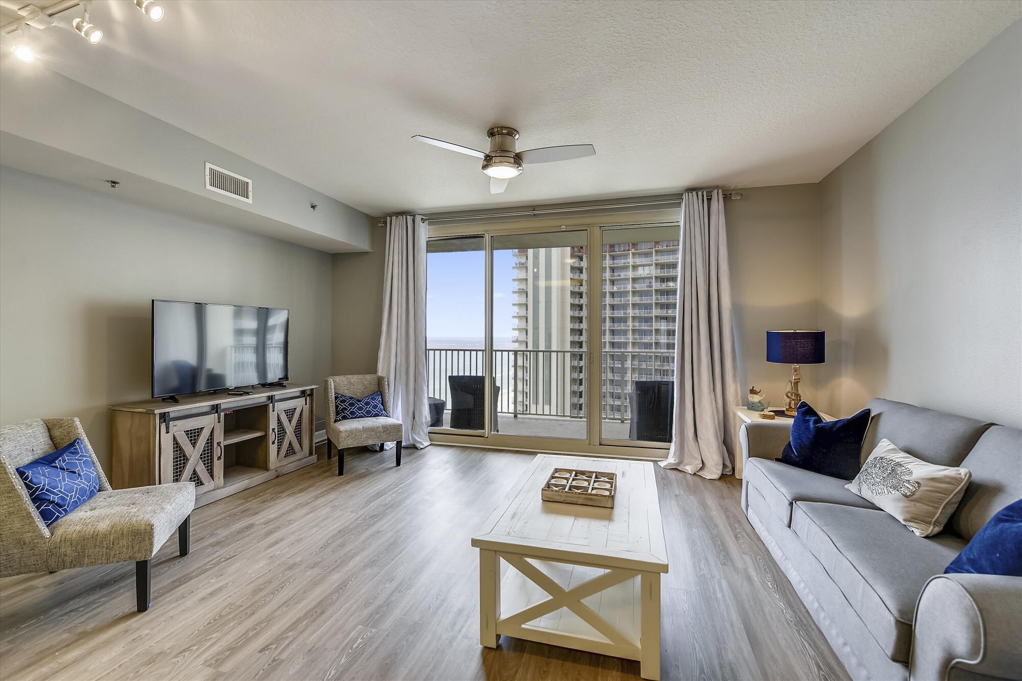 Living room area with sleeper sofa and access to the balcony