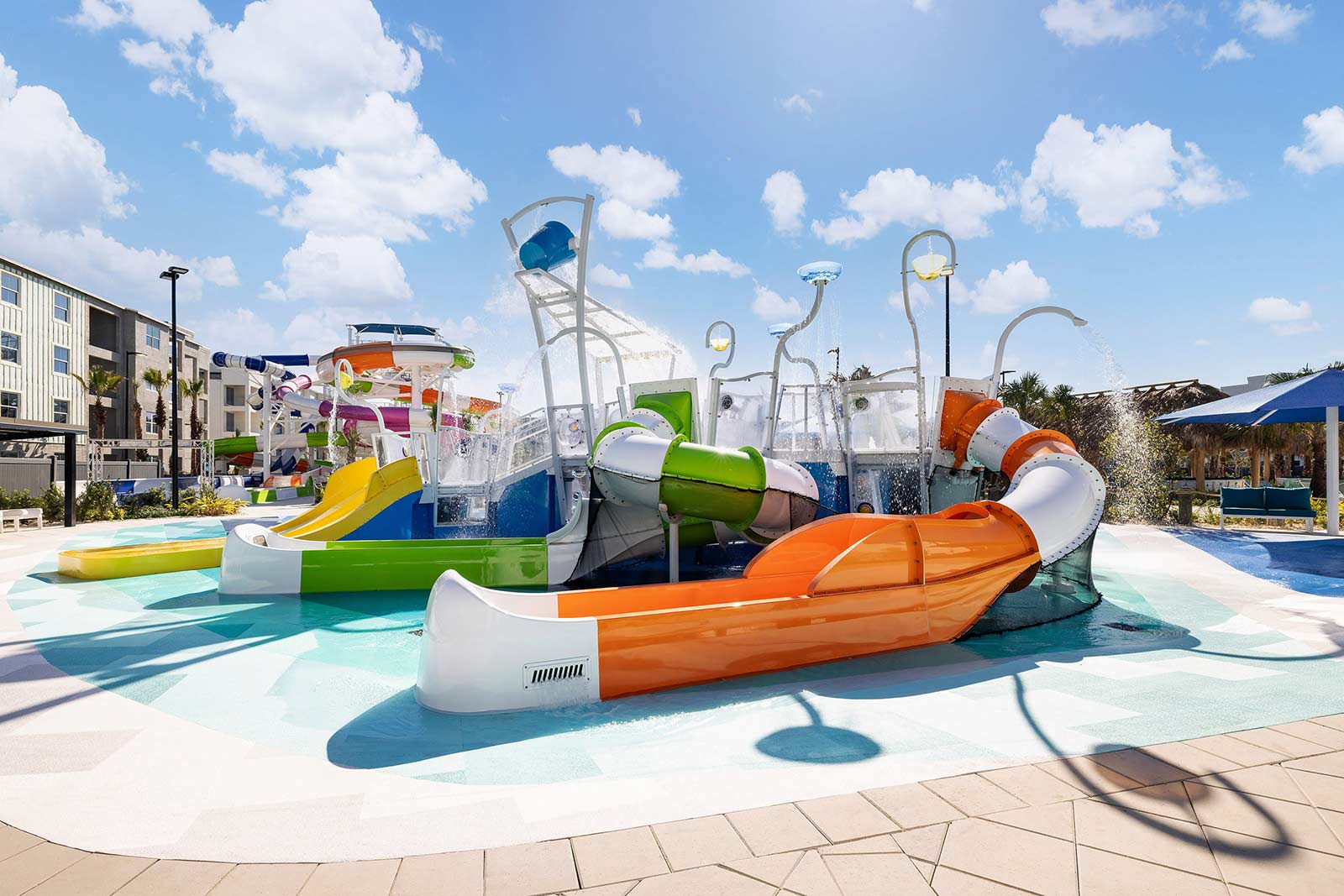 Enjoy a sun-soaked adventure at the Splash Cove Wet Playground at Aqua Bay
