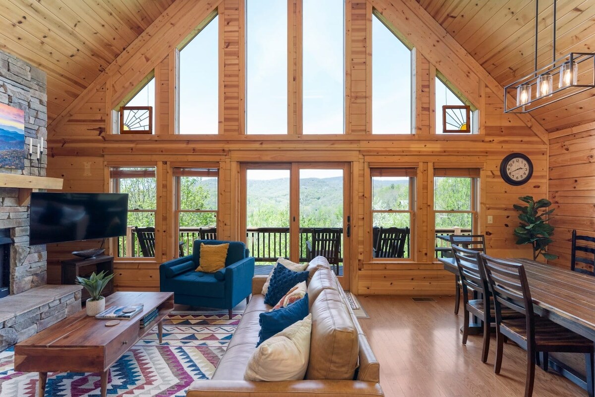 Open concept modern living room with mountain views