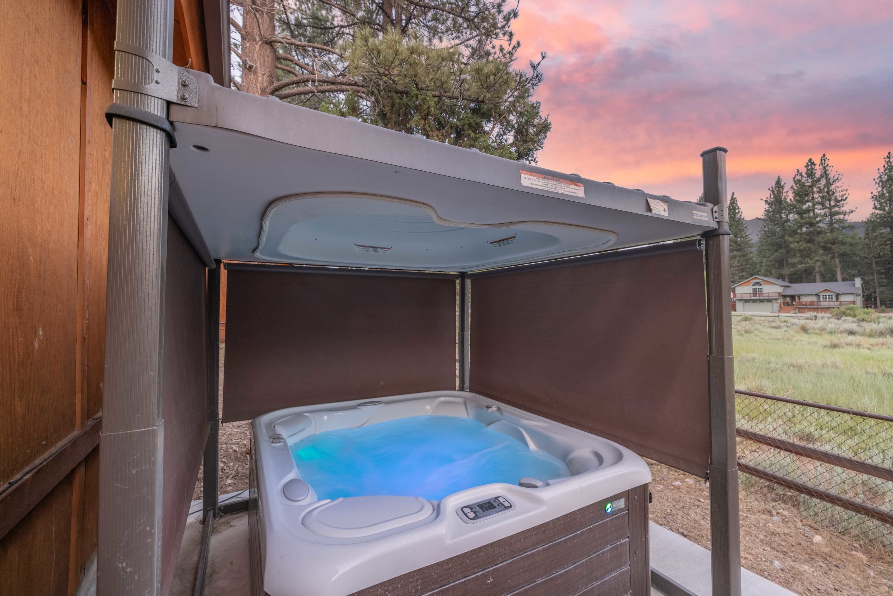 Relaxing LED SPA with auto lift cover and privacy curtains.