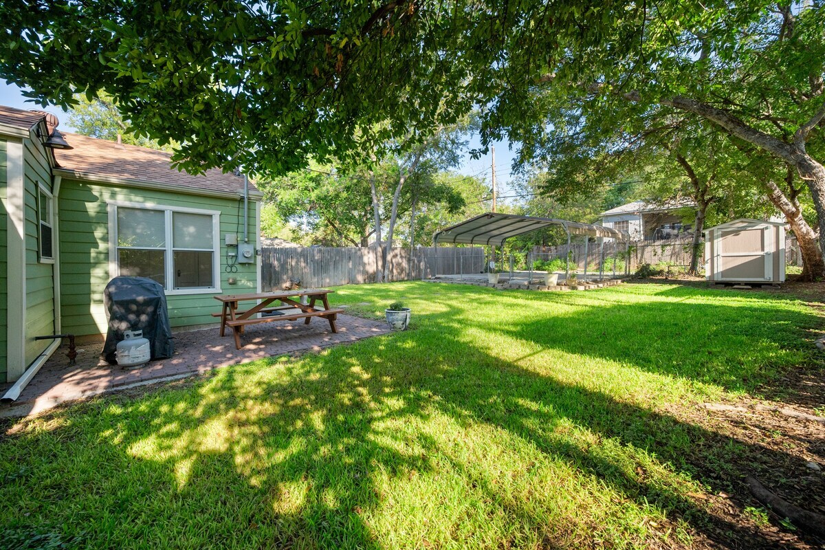 Nicely fenced grassy yard and private back Carport.