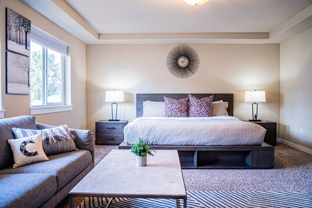 Elegant master bedroom with generous space, large windows for natural light, and a calming atmosphere perfect for restful island living.