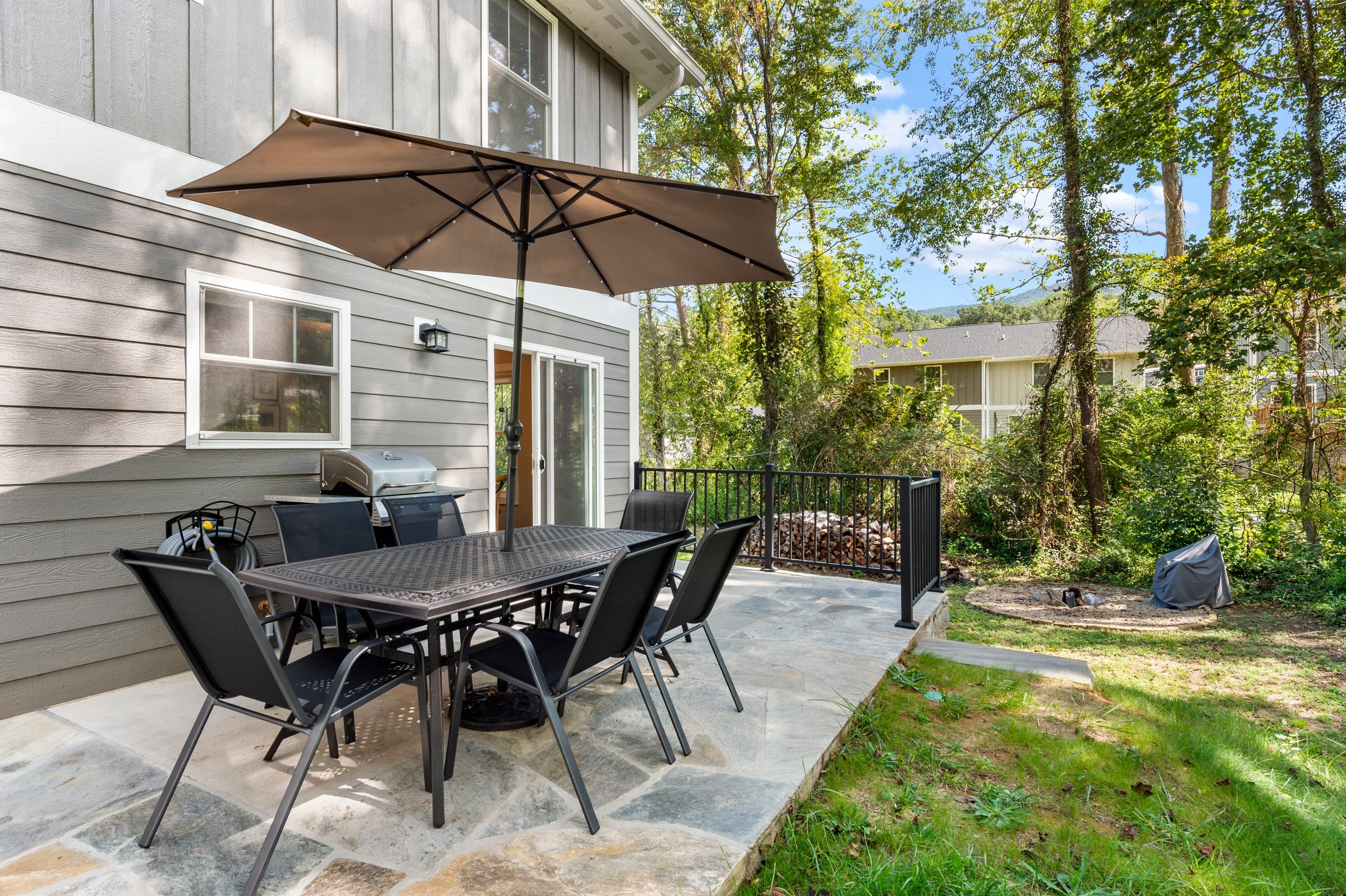 Back patio with an al fresco dining area.