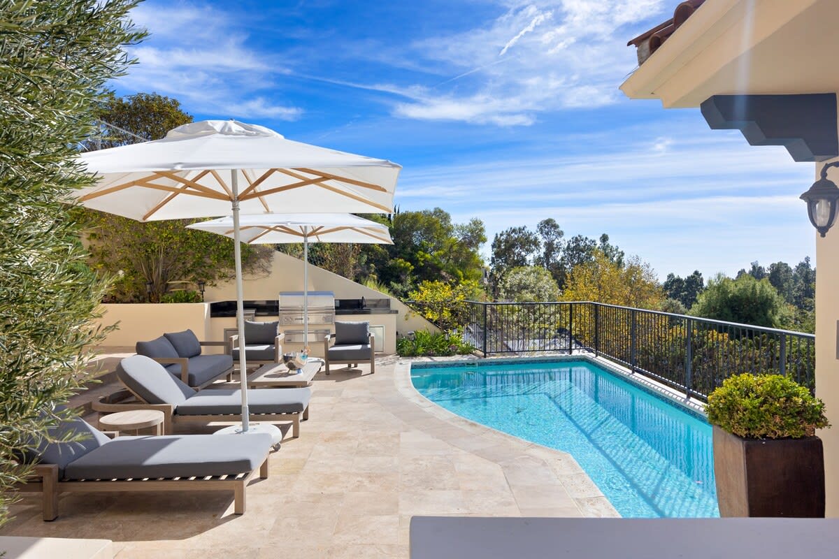 Take a dip in the gorgeous pool, conveniently located next to the outdoor BBQ and seating area