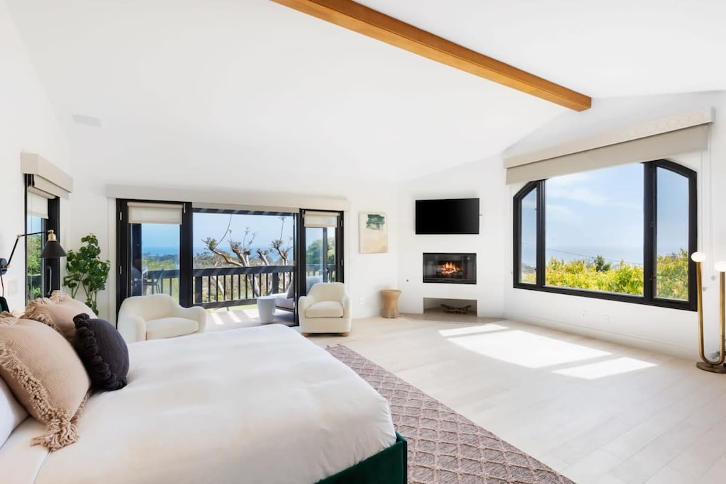 Master bedroom flows with ocean views and private balcony.