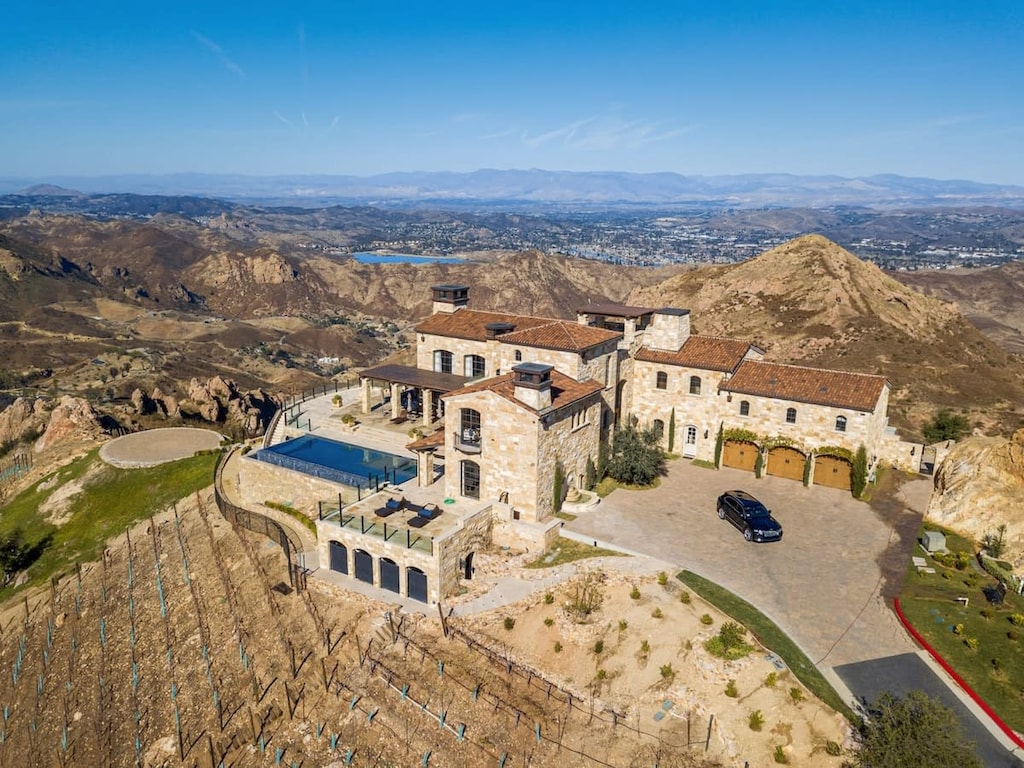 This estate is nestled on the top of the scenic Santa Monica Mountains surrounded by lush vineyards and gardens.