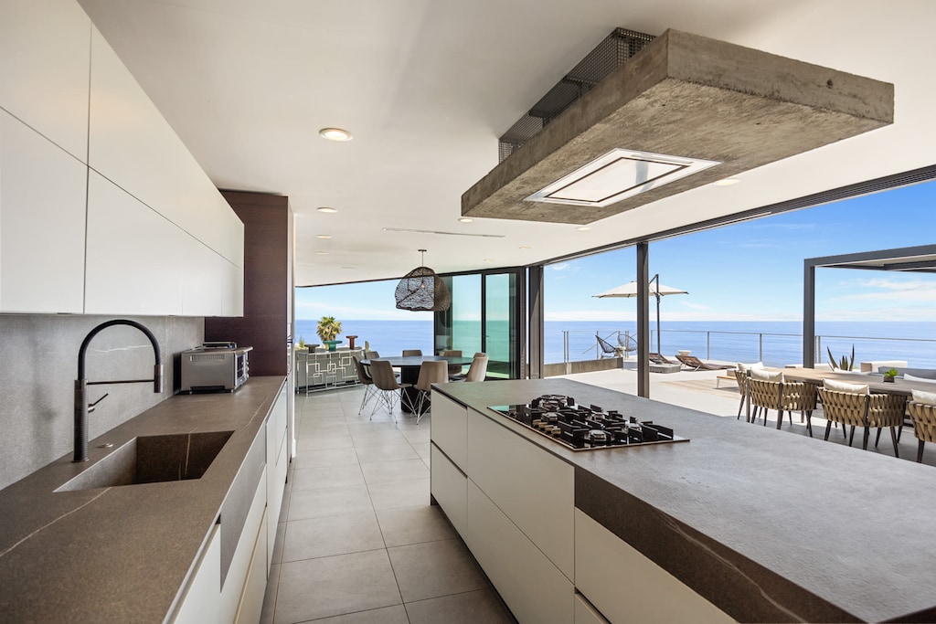 Cook gourmet meals in a European-style kitchen equipped with premium Miele appliances.