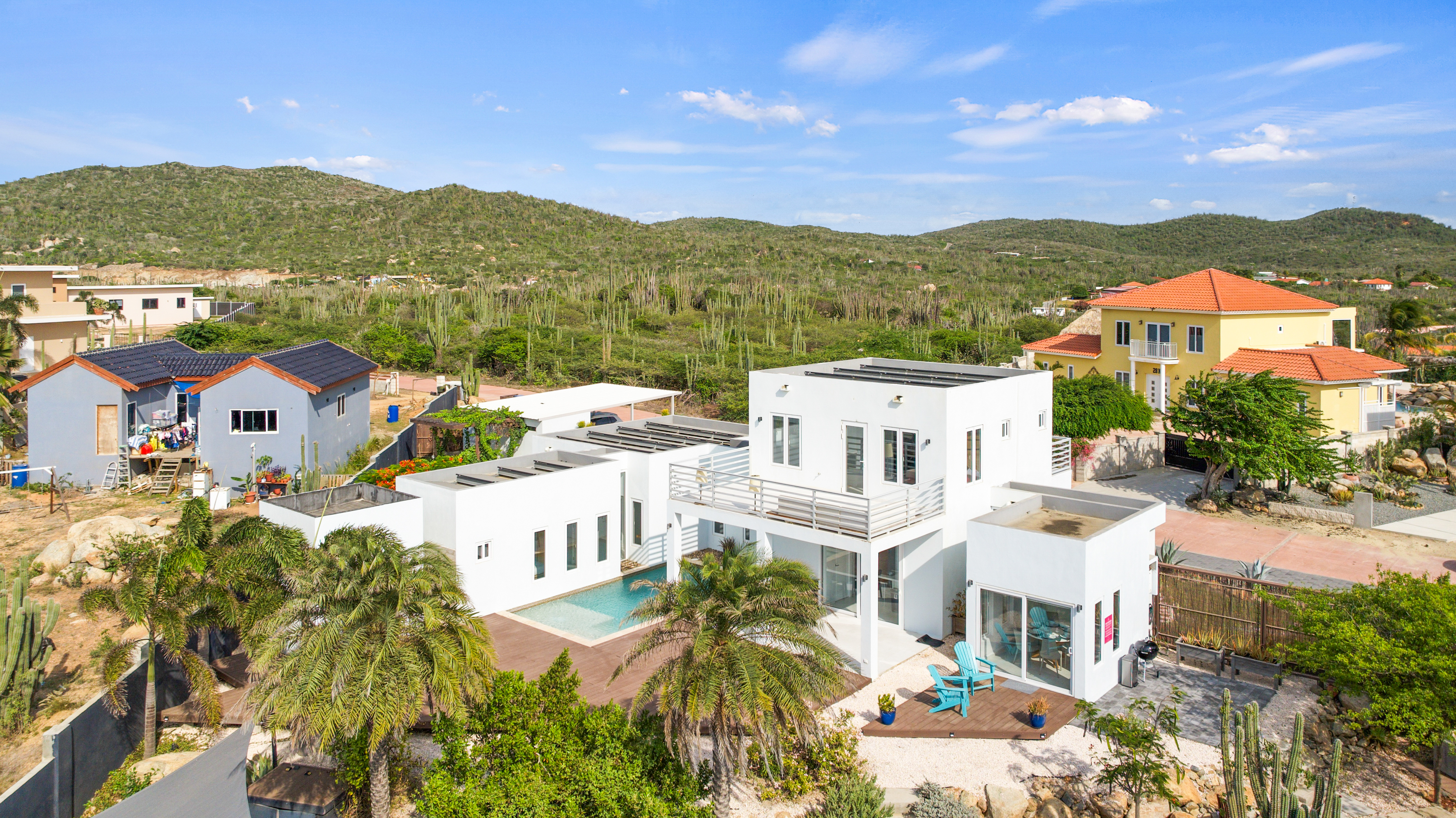 Stunning view showcasing the luxury vacation home - Inviting pool area - The lush natural surroundings of San Fuego - Greenery everywhere