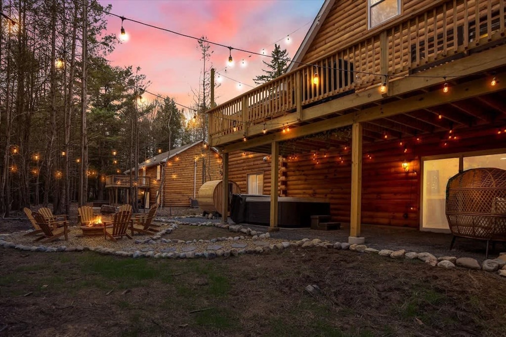 Driftwood Lodge's outdoor area has a hot tub, barrel sauna, fire pit and 'Instagram wall' seating area.