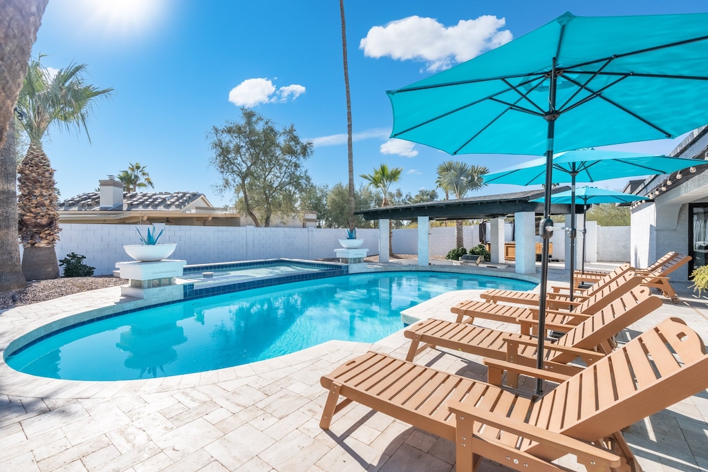 Soak up the sun poolside with 6 loungers + 2 built in at the wading pool