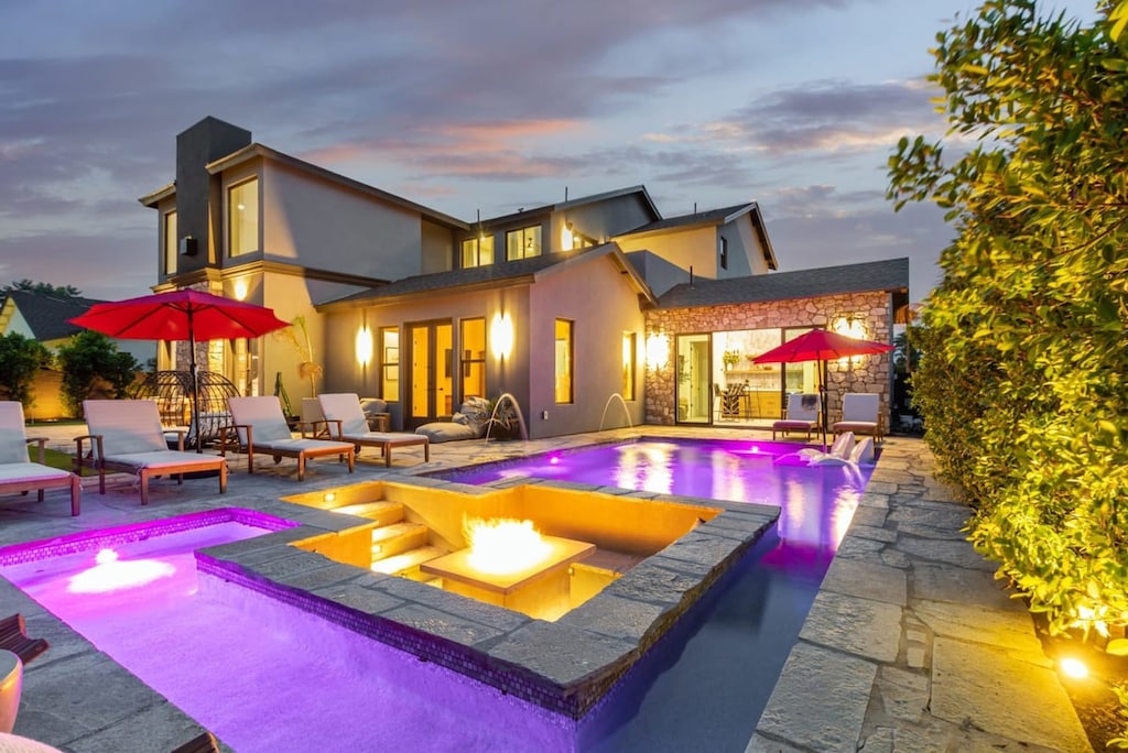 Modern Backyard Oasis with Custom Play Pool and Sunken Firepit