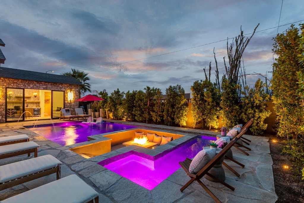 Custom Stone/Pebble Tec Pool with Sunken FirePit Lounge