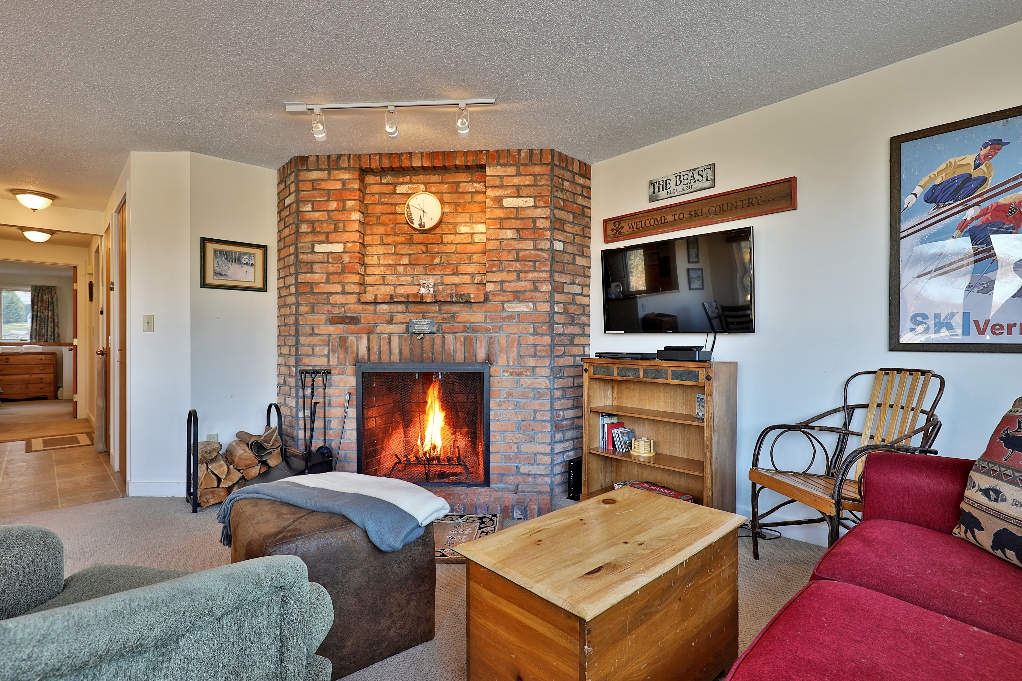 Relax in the cozy living room with wood burning fireplace