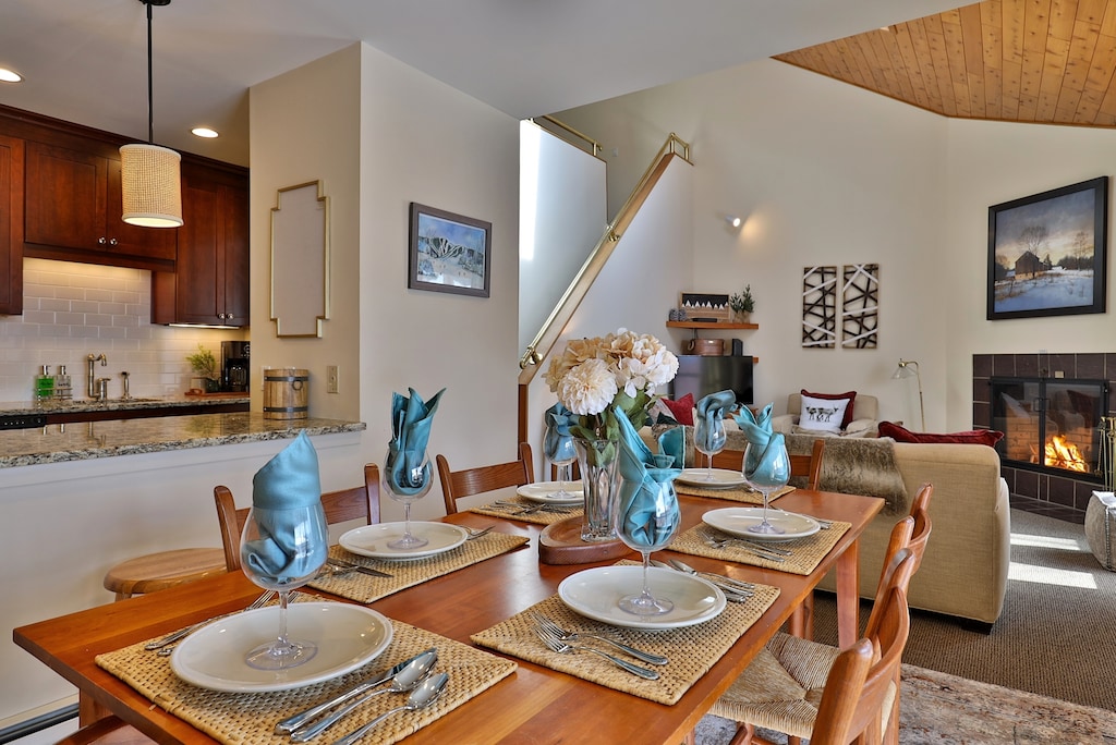 View from dining area into kitchen and living area