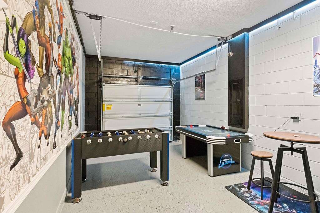 Game On: Our entertainment hub boasts an air hockey table, foosball, and arcade games for endless fun and friendly competition.