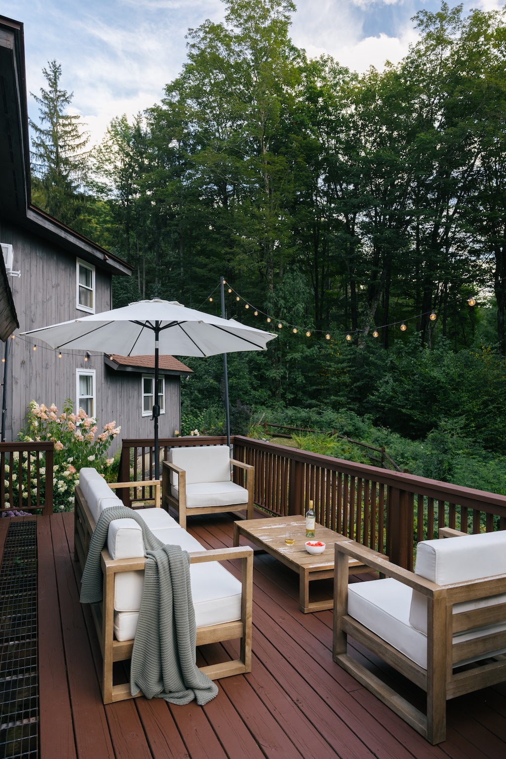 Cozy outdoor seating with a view of the forest.