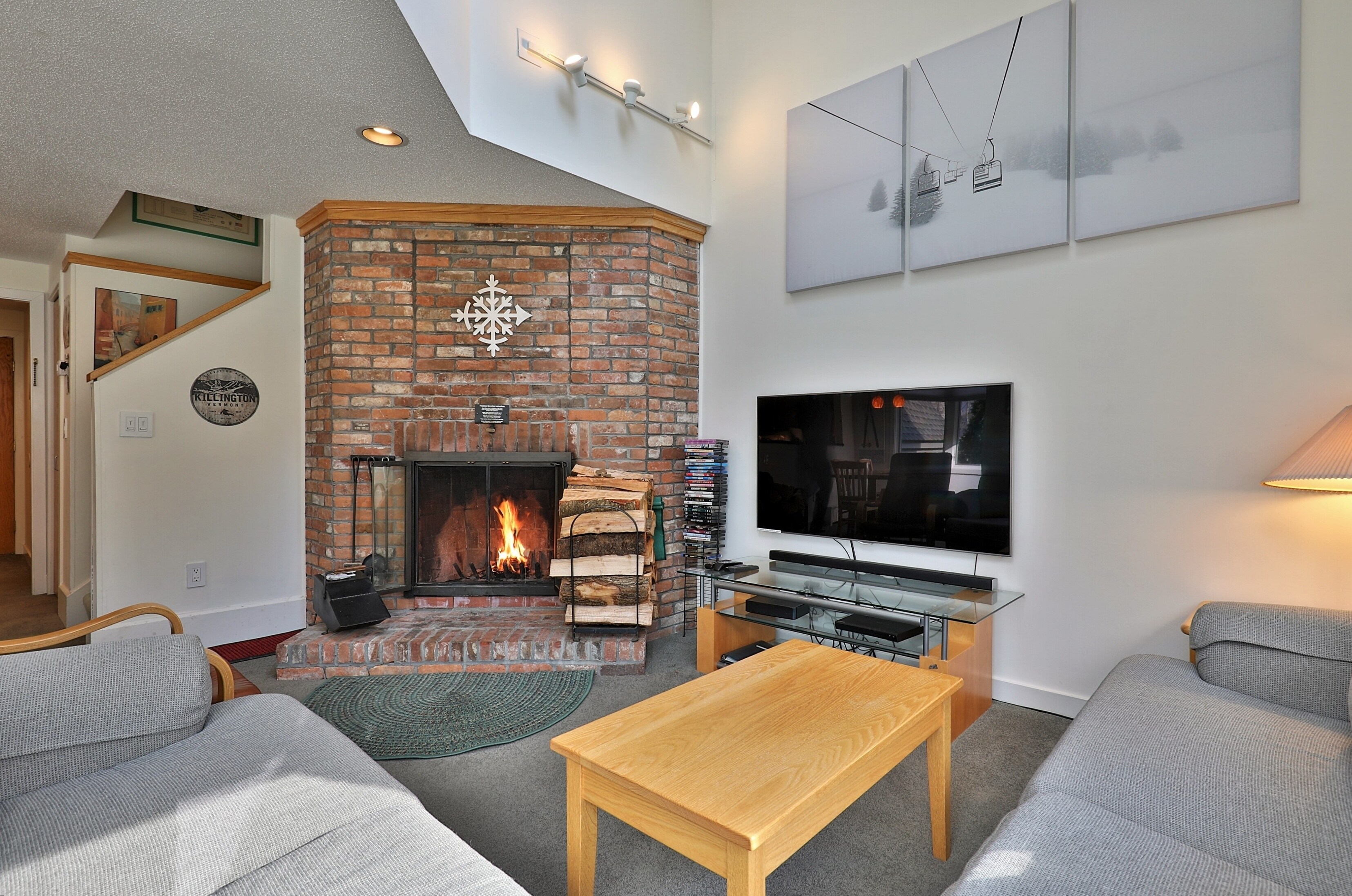 Warm up after a day of skiing in the cozy living room with wood burning fireplace.