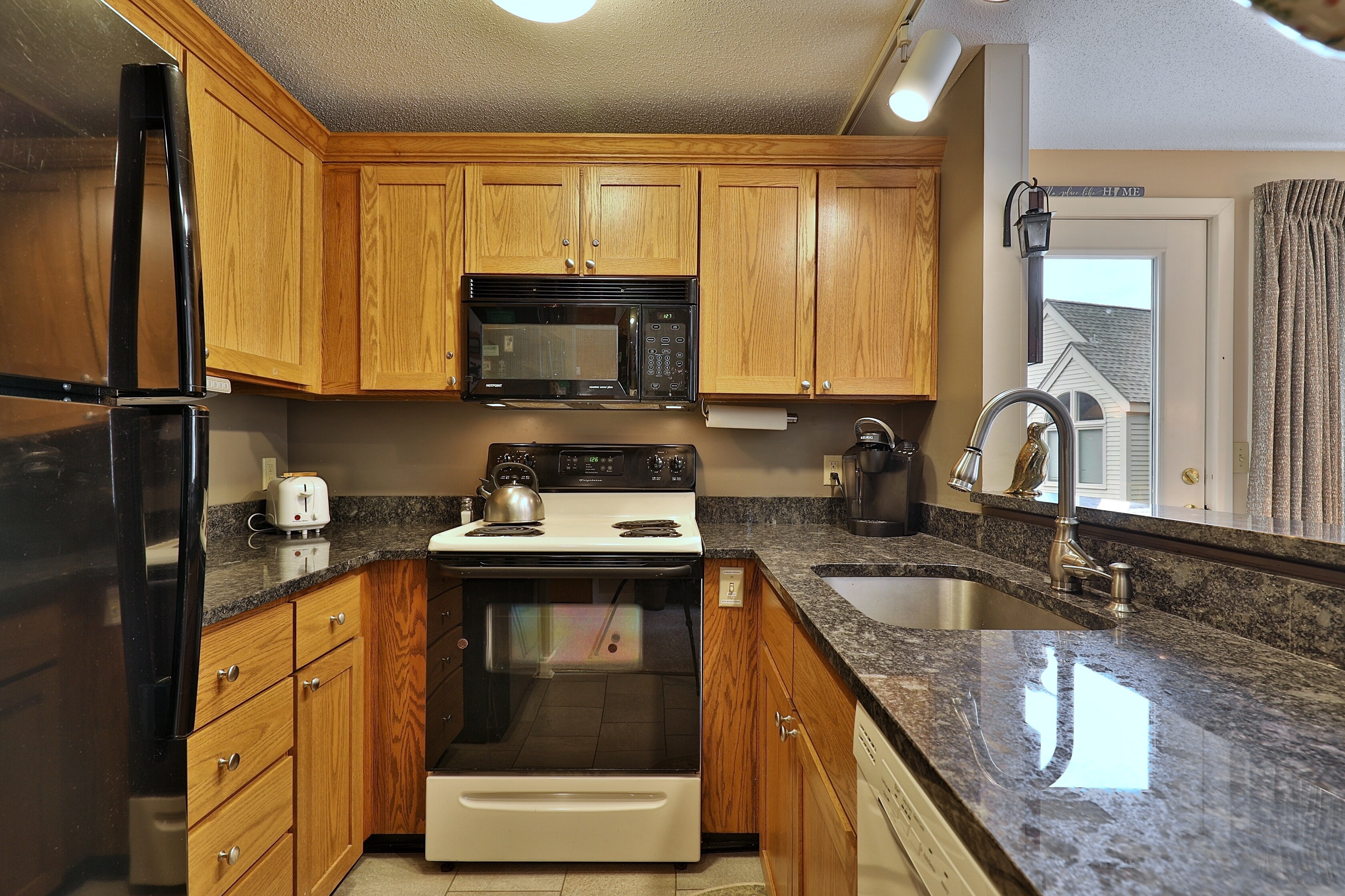 Fully equipped kitchen with granite countertops