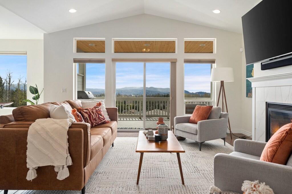 Nestled in comfort, the cozy living area seamlessly extends to the balcony, inviting the outdoors in for a serene retreat.