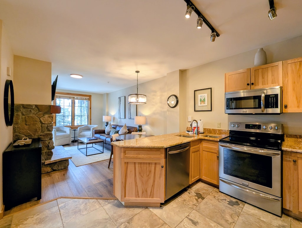 Your open-concept kitchen seamlessly flows into the cozy living area, creating the perfect space for cooking and relaxing together.