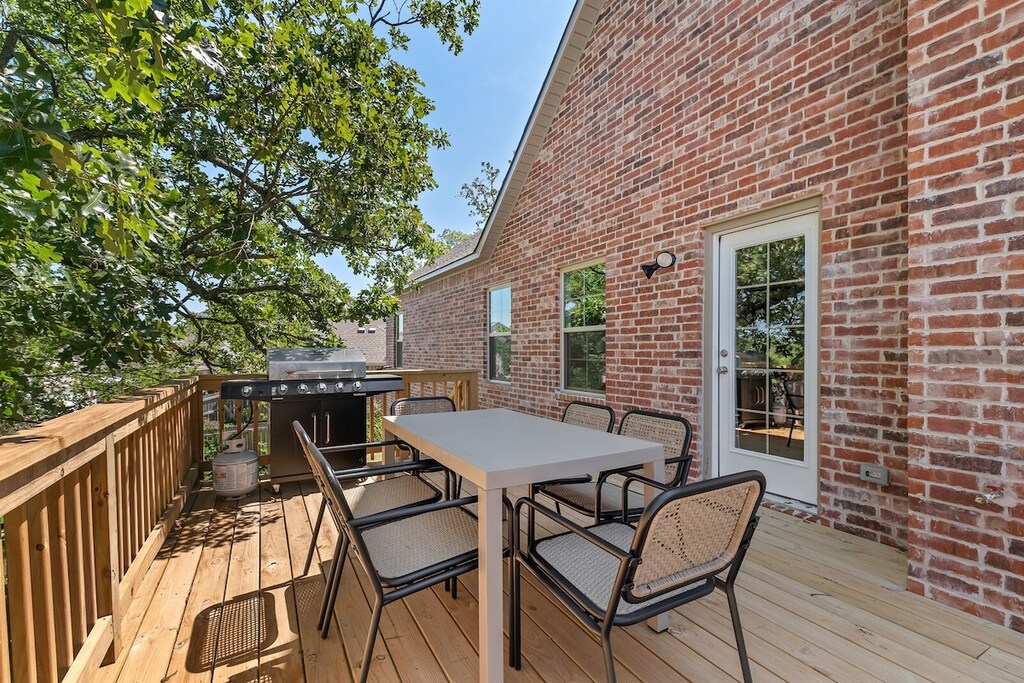 Enjoy our spacious patio, with access to a Charbroil propane grill, 6-top outdoor dining table and stairs leading down to the shady backyard.