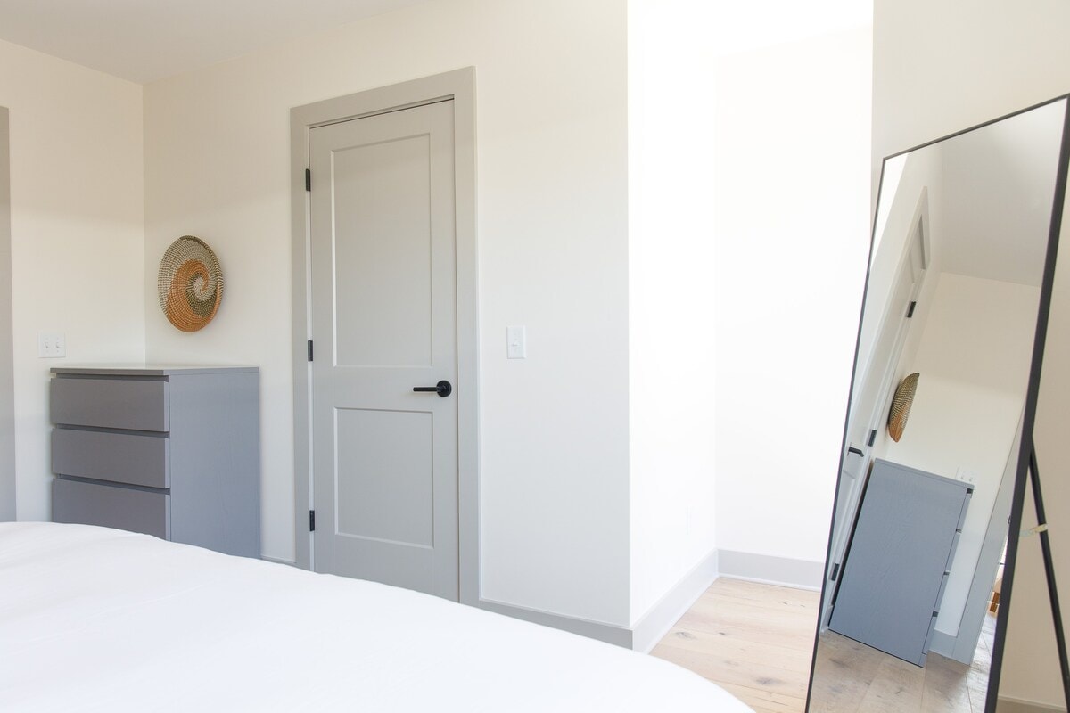 You can find the dresser, closet and full-length mirror at the foot of the bed.