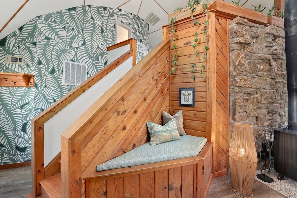 Just inside our home, enjoy our 3-story mural wall and cozy reading nook.