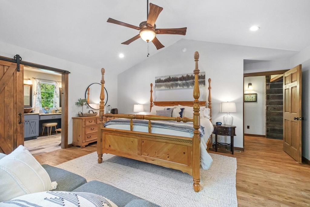 This King Suite features a plush bed, luxury linens and bedding, a comfy sofa, large windows, deck access, and an en suite bathroom.